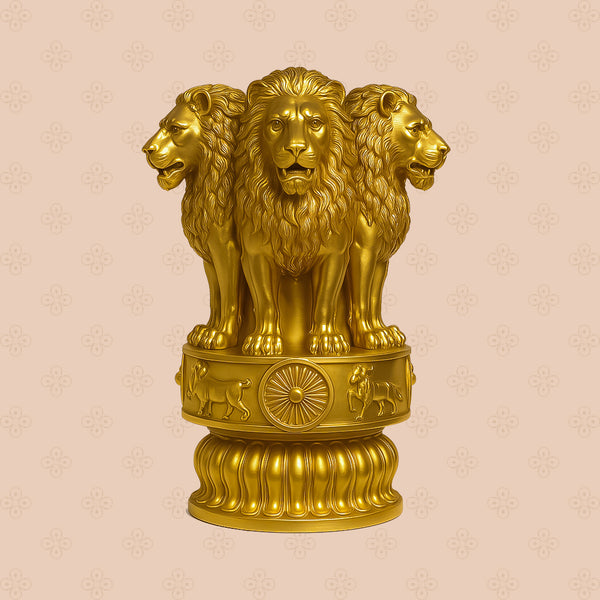 Gold statue of three lions on a decorative pedestal against a beige background