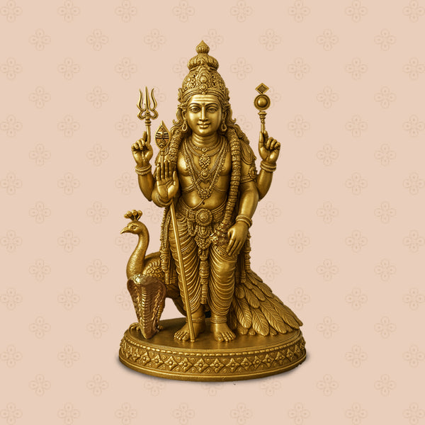 Gold-colored statue of a deity with a peacock on a beige background
